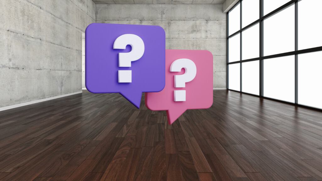 Empty office space with question marks representing how much space you may need for a business